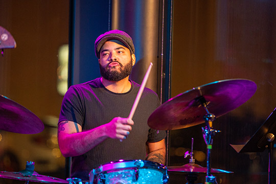 Drummer Miguel Jimenez-Cruz performed on stage.