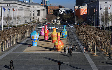 Six vase-shaped bamboo sculptures installed at the Civic Center Plaza in San Francisco.