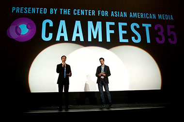 The Director of the Hong Kong Economic and Trade Office in San Francisco, Mr Ivanhoe Chang (left), speaks at a movie theatre event honoring Hong Kong filmmakers before the screening of “The Moment” in San Francisco as part of CAAMFest.