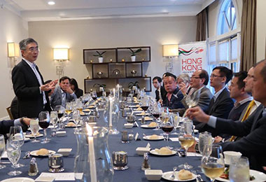 Hong Kong Secretary for Financial Services and the Treasury, Mr James Lau (first left), shares details of the vast investment opportunities Hong Kong can offer to overseas investors with venture capitalists at a dinner meeting in Silicon Valley on May 29.