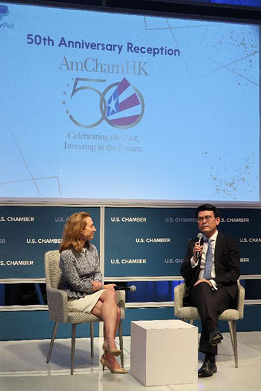 Hong Kong Secretary for Commerce and Economic Development, Mr Edward Yau (right), delivered remarks at the reception in celebration of the 50th anniversary of the American Chamber of Commerce in Hong Kong in Washington, DC on June 10.