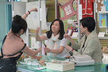 Visitors to the Center for Heritage, Arts and Textile at The Mills take part in hand spinning workshops