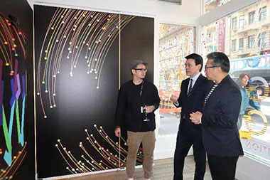 Hong Kong Secretary for Commerce and Economic Development, Mr Edward Yau (Center) with Hong Kong designer Henry Chu (left) and Chairman of the Hong Kong Design Centre, Prof Eric Yim at the Co-Creating Hong Kong: a design+ exhibition in San Francisco.